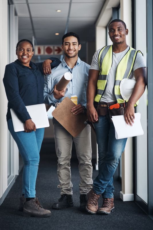 People, blueprint and portrait for contractor, architect and inspection for building site. Manager, floor plan and group with development team for engineering, construction and project management